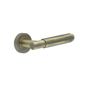 Apennine Lever On Round Rose Antique Brass Finish